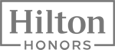 The image shows the Hilton Honors logo, consisting of the word "Hilton" in a rectangular frame above the word "Honors" in uppercase letters.