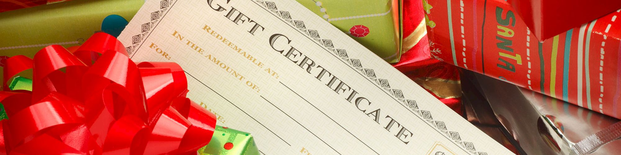 An image showing a gift certificate surrounded by colorful wrapped presents, including one with 